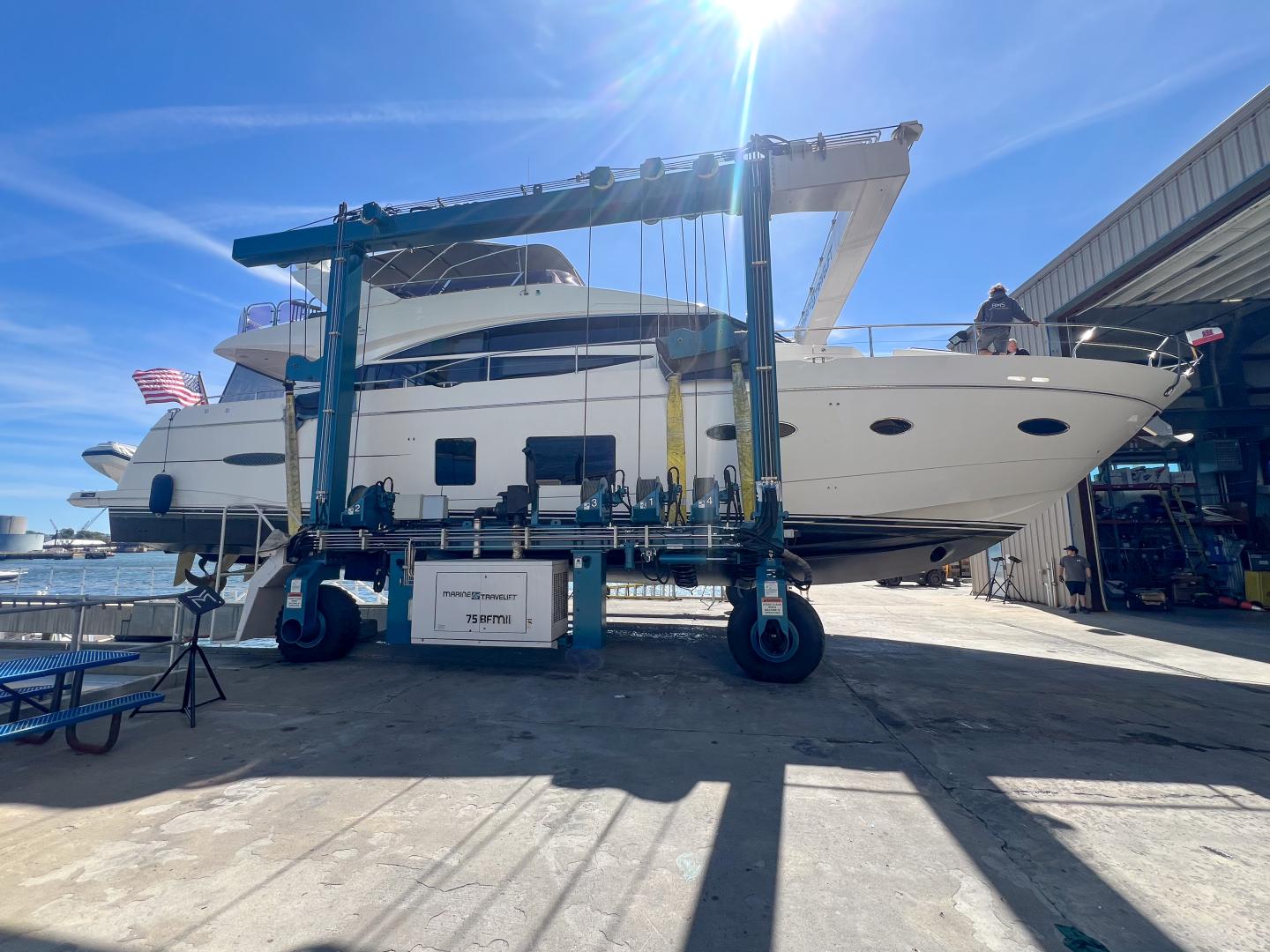 Yacht in travel lift at Boston Marine Services